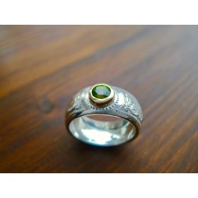 Domed silver Celtic ring with gold bezel.
Irish Jewellery, handcrafted in Ireland