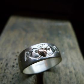A work in progress photo showing the tool marks in an unfinished Rose gold Claddagh ring. Irish jewellery